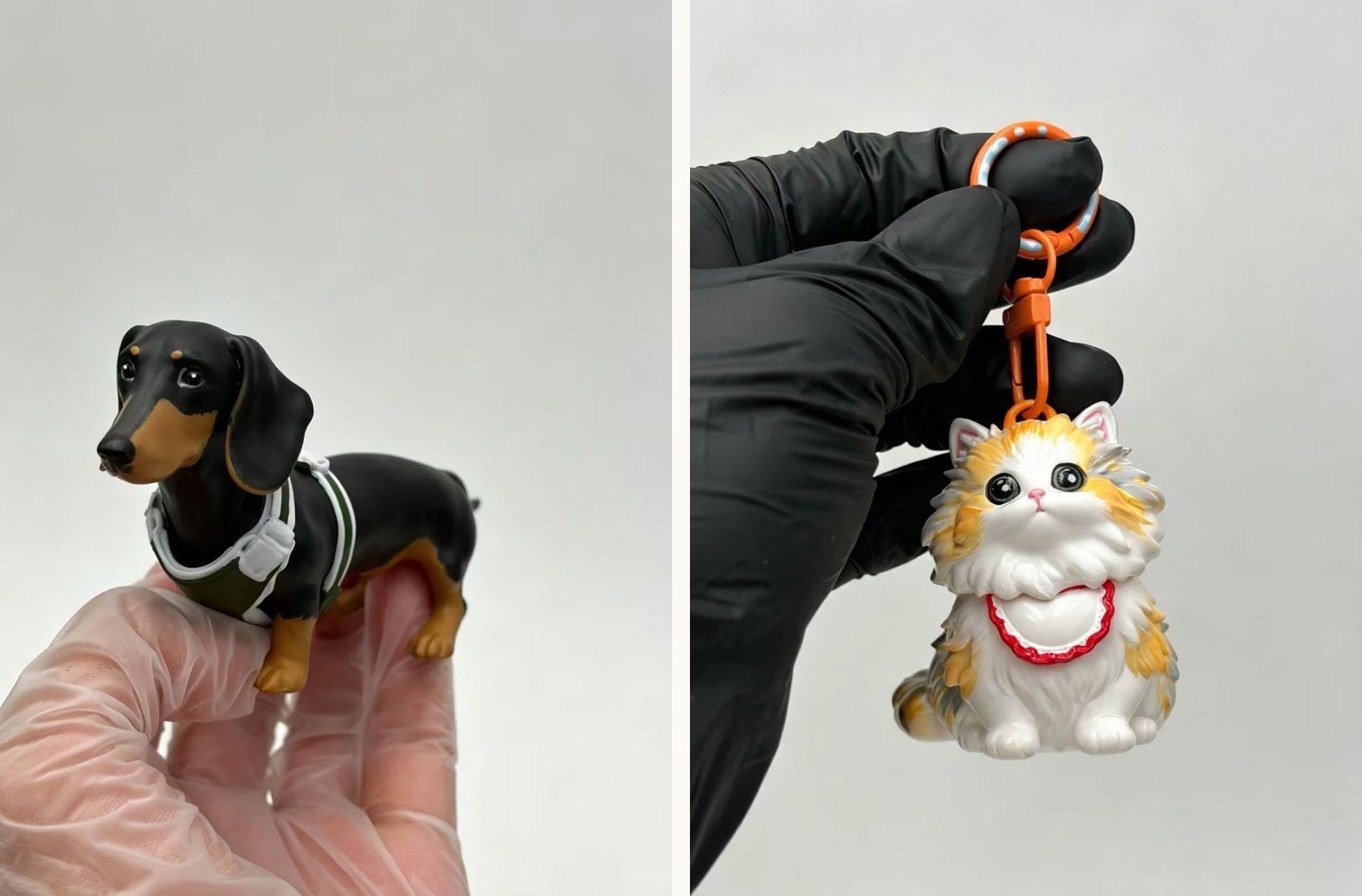 A dachshund figurine held in a gloved hand, and a calico cat keychain held by its clip